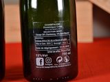 two bottles of wine that are on a table