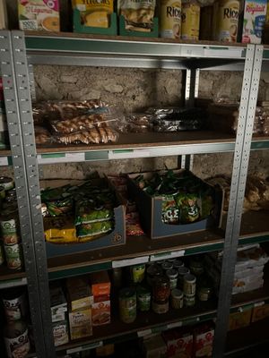 many shelves of food and condiments in a store