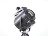 a black light on a tripod on a white background