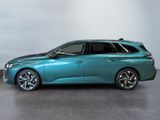 the blue car is parked on the concrete floor in the room