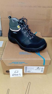 a box with a pair of black boots on it