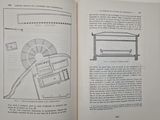 an open book with a drawing of a building on it