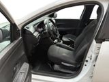 the interior of a car with the door open and the driver ' s seat down