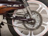 a close up of a motorcycle with a chain attached to it