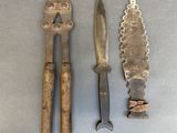 three different types of knives and a knife holder on a table