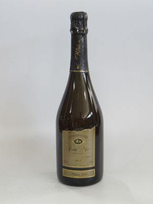an empty bottle of wine sitting on a white surface