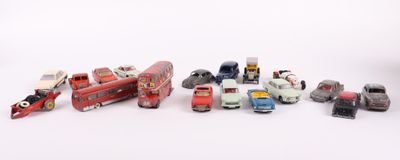 a lot of toy cars that are on a white surface