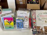 many boxes of cards and other items on the table
