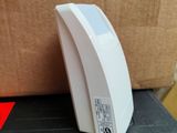 an image of a white electronic device on a box