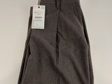 a close up of a person ' s pants on a white surface