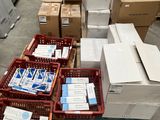 several boxes of mail are stacked on top of each other in a warehouse
