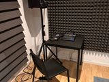 a chair and a table in a room with a laptop