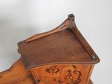 a small wooden table with a drawer on it