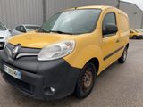 yellow and black van parked in a parking lot next to other cars