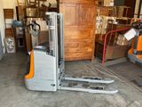 a fork lift truck parked in a garage
