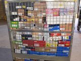a metal cart with many boxes on it in a warehouse