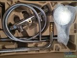 a box with a hose, hose, and other items in it
