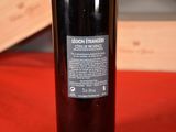 a bottle of wine that is sitting on a table