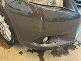 a close up of a car ' s front bumper