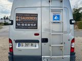 a van that has a ladder on the back of it
