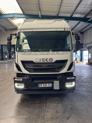 a white truck that is parked inside of a building