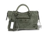 the bale bag is made of sued and has a metal handle