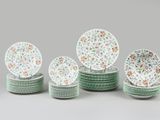 several plates with floral designs are stacked on top of each other