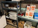 many boxes and containers on the shelves in the room
