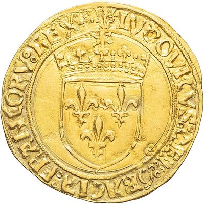a close up of a gold coin with a crown on it
