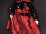 an image of a close up of a doll on a black surface