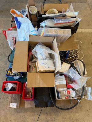 a pile of boxes and other items sitting on the floor