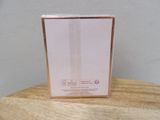 the box is empty on the wooden table with a white wall in the background