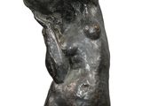 statue of a woman holding her head in her hands