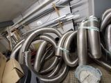 a bunch of metal pipes that are sitting on the floor
