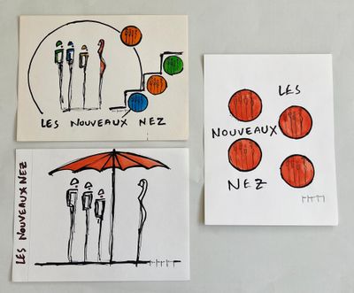 three cards with drawings of people and an umbrella on a refrigerator