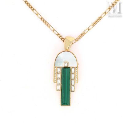 a close up of a necklace with a green stone on it