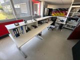 an image of a room with a desk and a chair