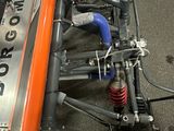 a close up of a race car with the front end of it ' s engine