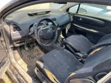 the interior of a car with the door open and the steering wheel down