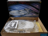 a box with a model of a star trek ship in it