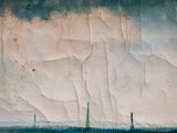 a painting of a sailboat in the water on a cloudy day