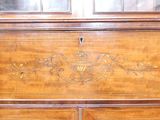 a wooden chest with a decorative design on it