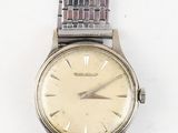 an image of a wrist watch on a white surface