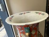 a vase that is sitting on a table outside