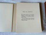 a book open to a poem on a table
