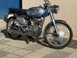 a motorcycle that is parked on the side of the street