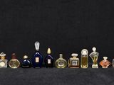 many bottles of liquor lined up on a black surface