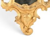 a gold clock with a black face on a white background