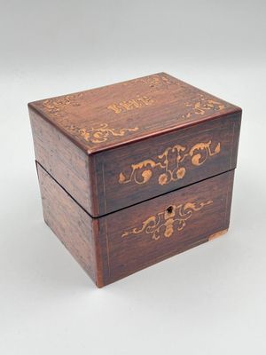 an image of a small wooden box with a floral design