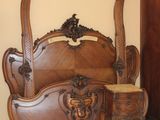 several pieces of furniture are displayed in a room with a beige wall